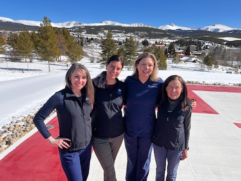 St. Vincent Health nurses in a group outdoors on the helipad.
